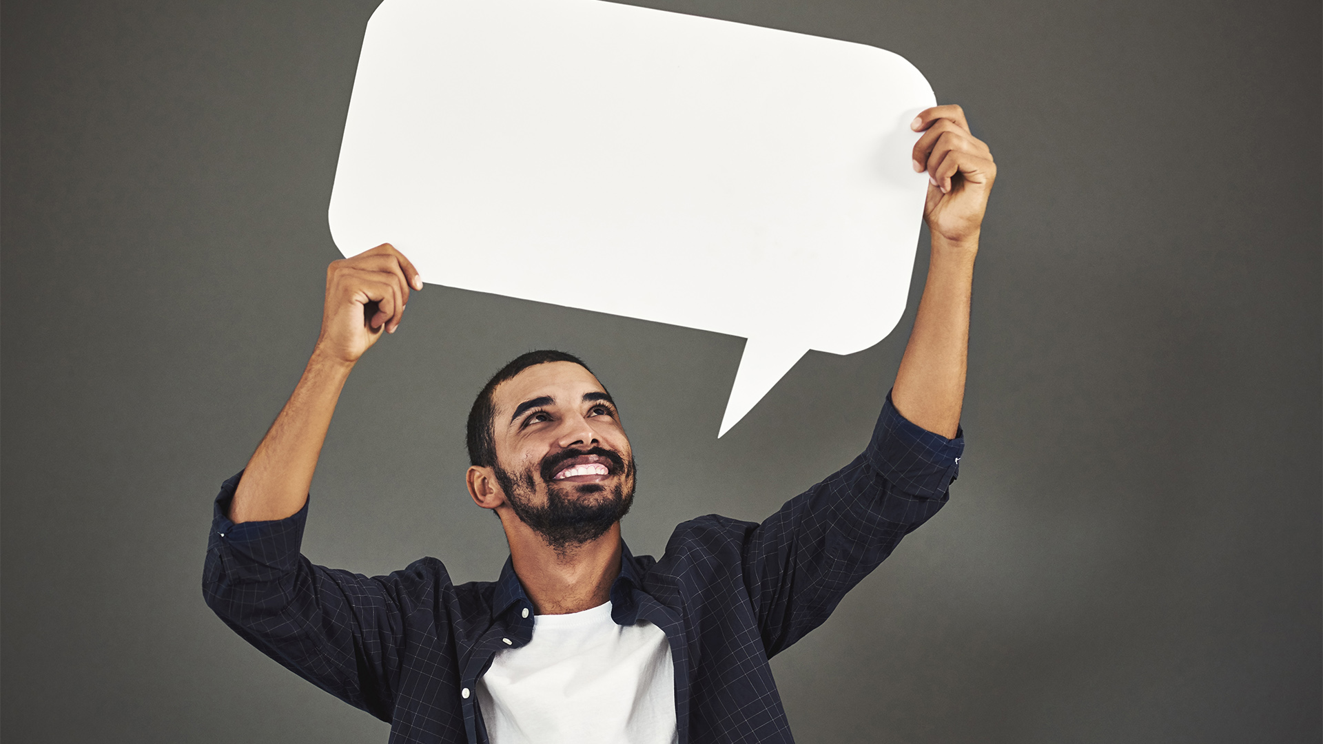 Man holding a speech bubble