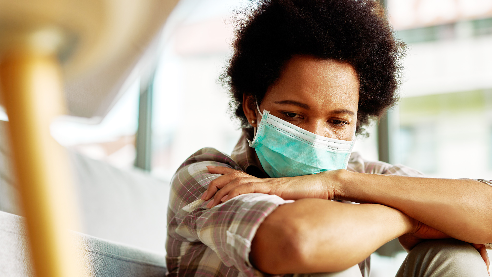 Concerned woman wearing face mask
